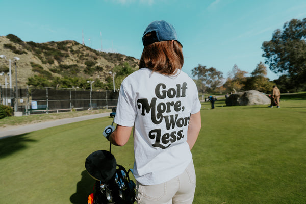 Golf After 5 "Golf More, Work Less" women's white t-shirt, back view, female model